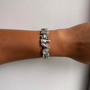 SILVER TONE MUSICAL THEMED SLIDING CHARM BRACELET